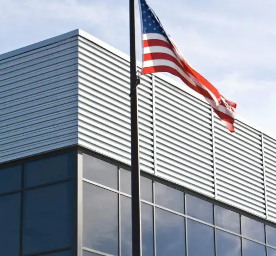 commercial glass windows and an american flag
