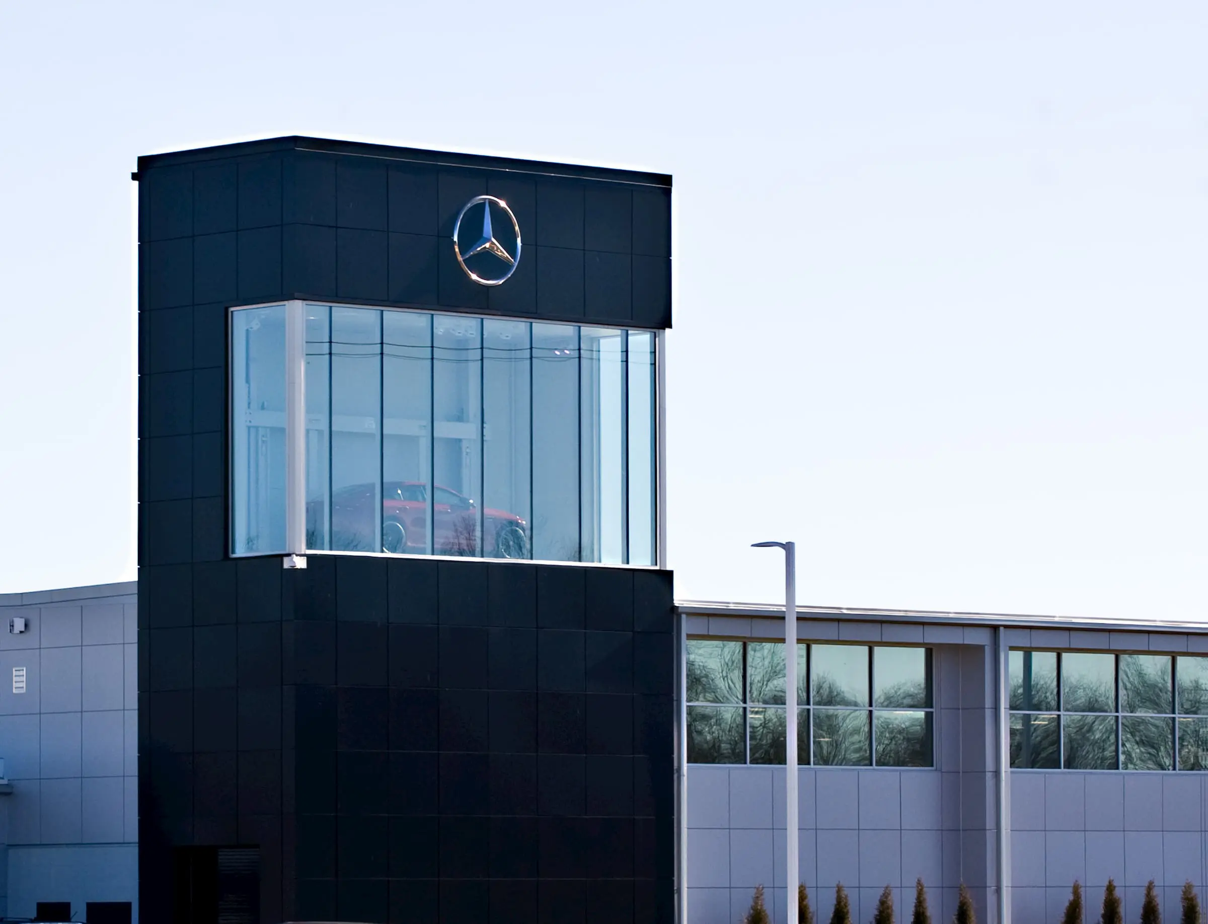 A glass display case for a car