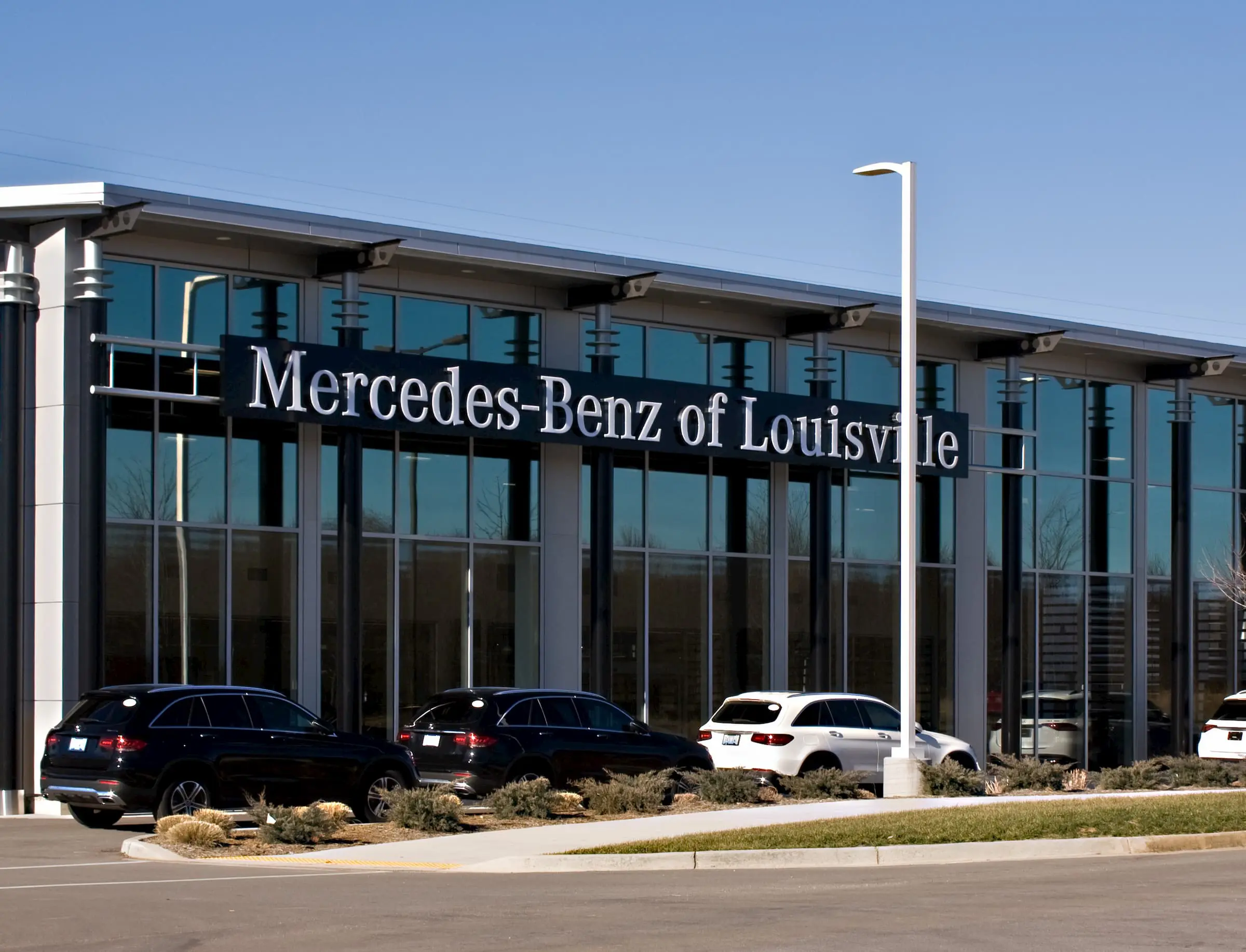 a glass storefront on a car dealership