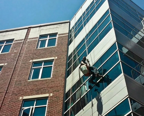 Cleaning windows on a tall building
